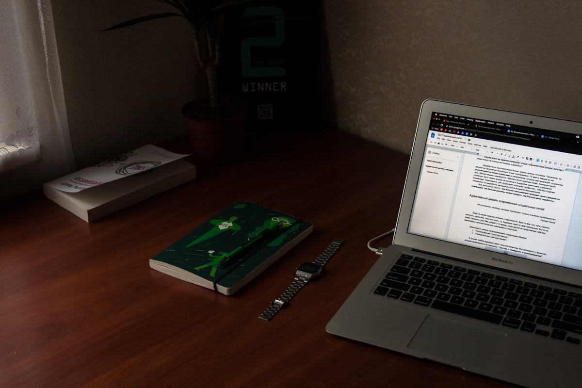 turn on MacBook Air near books