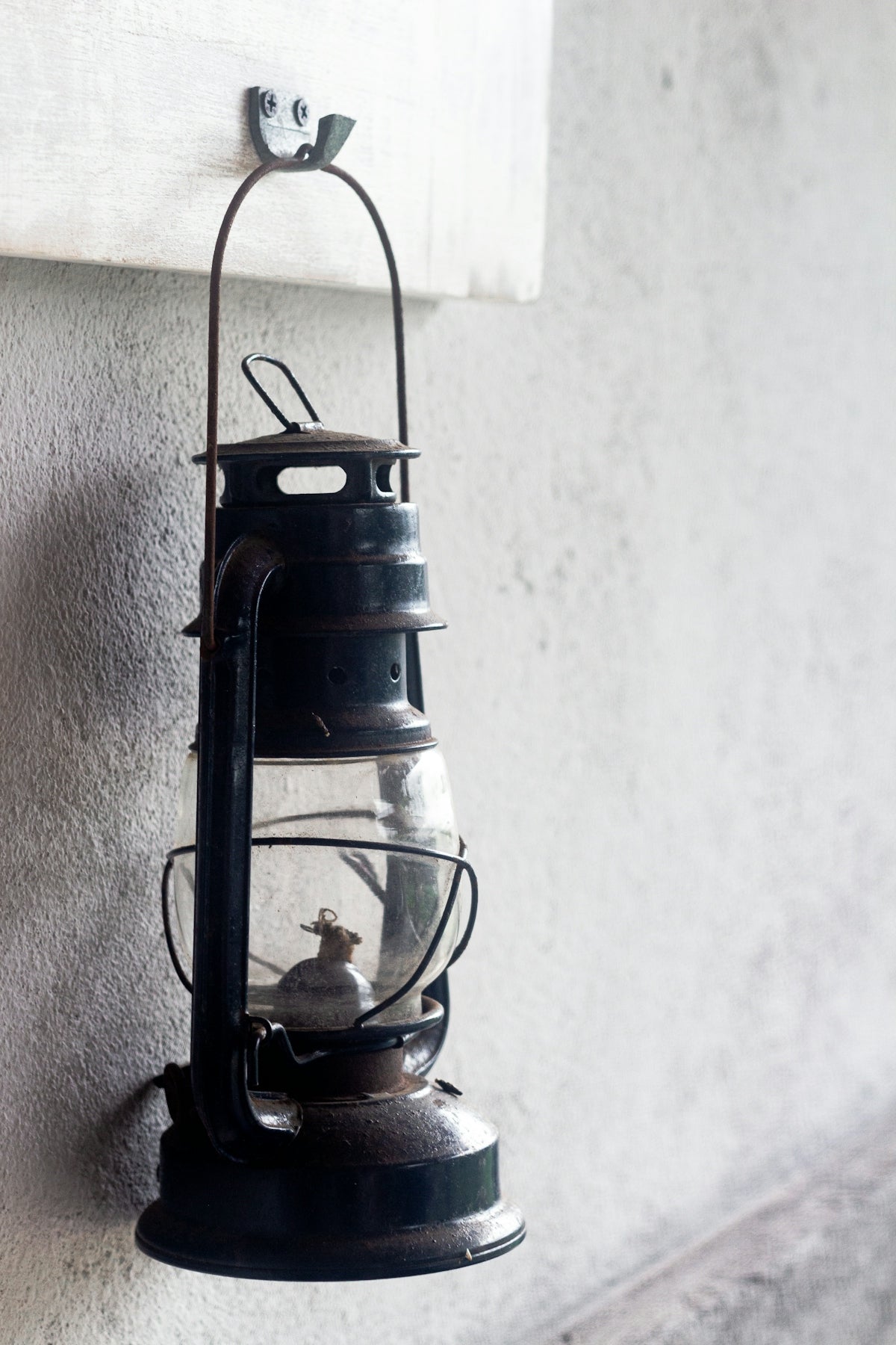 a lantern hanging on the side of a building