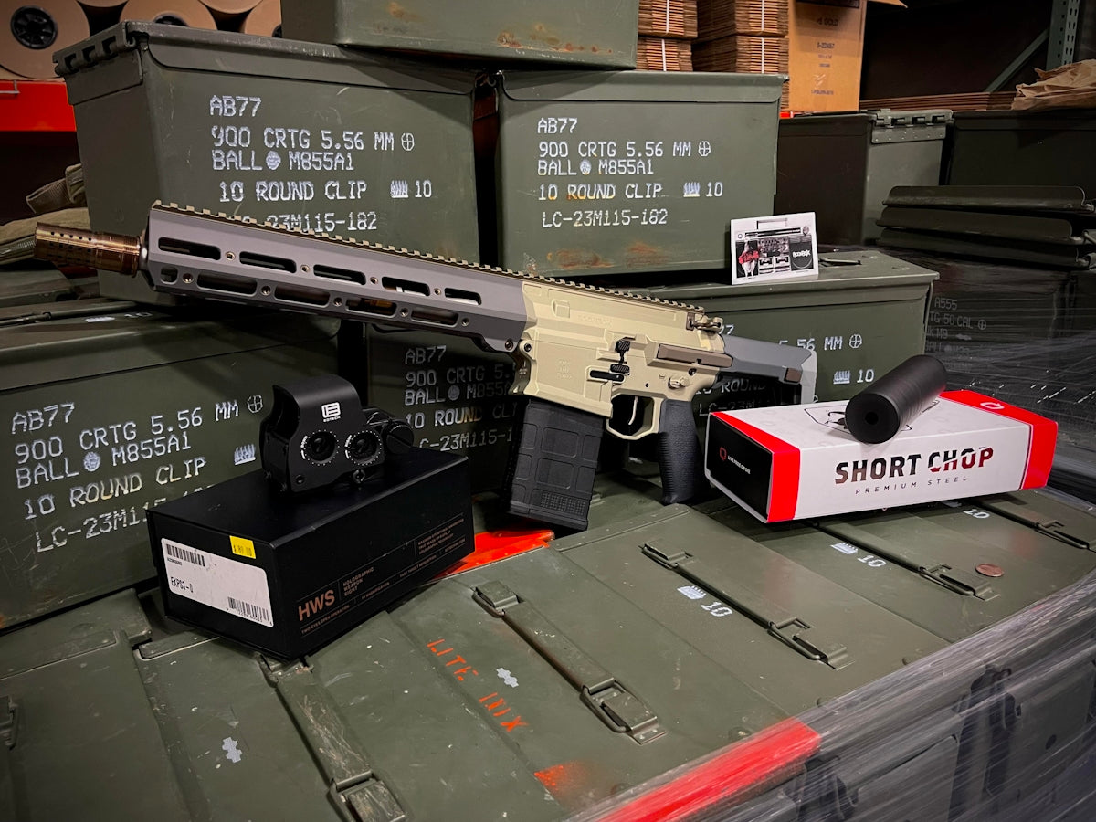 Rifle components and ammunition boxes arranged together