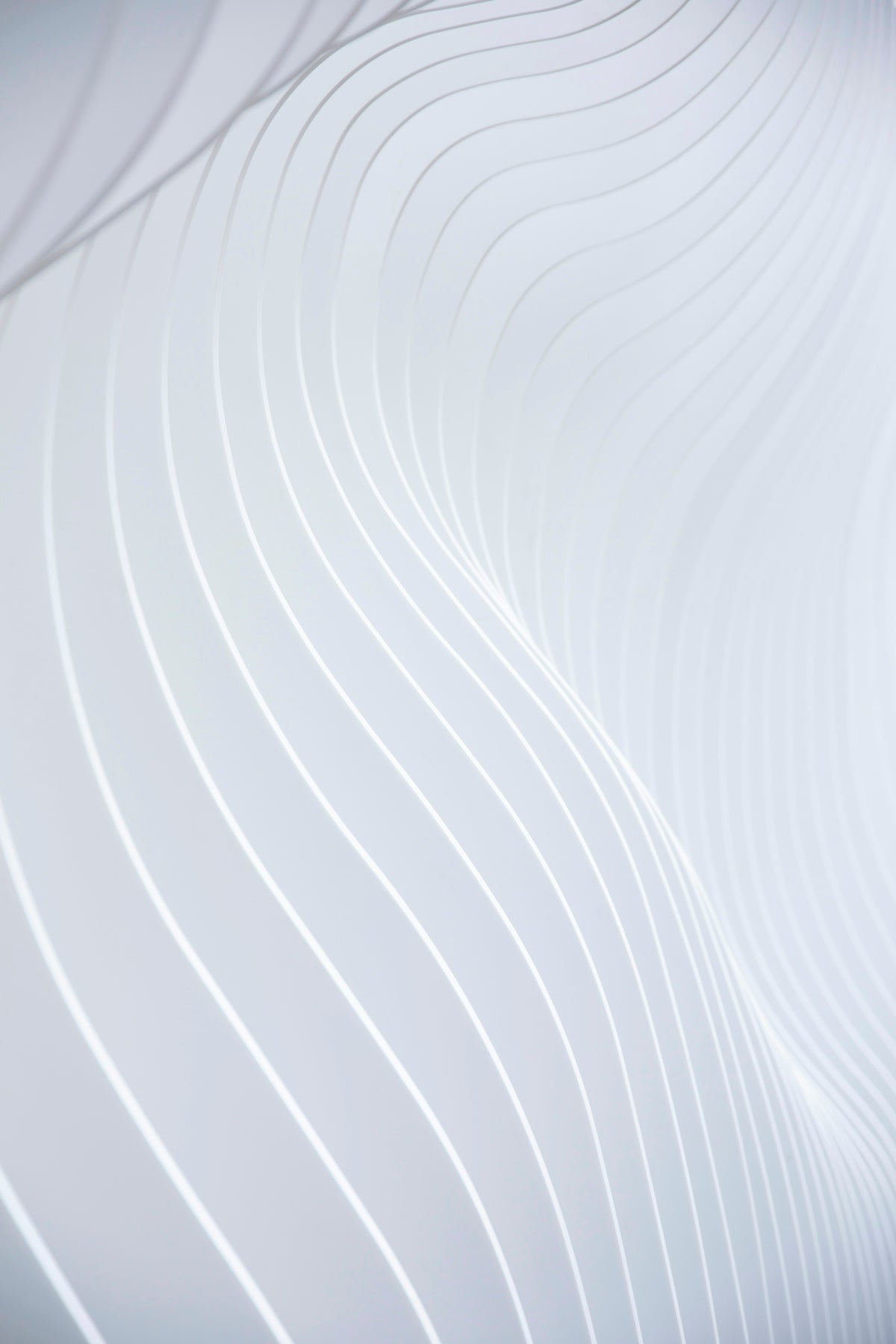 a close up of a white wall with wavy lines