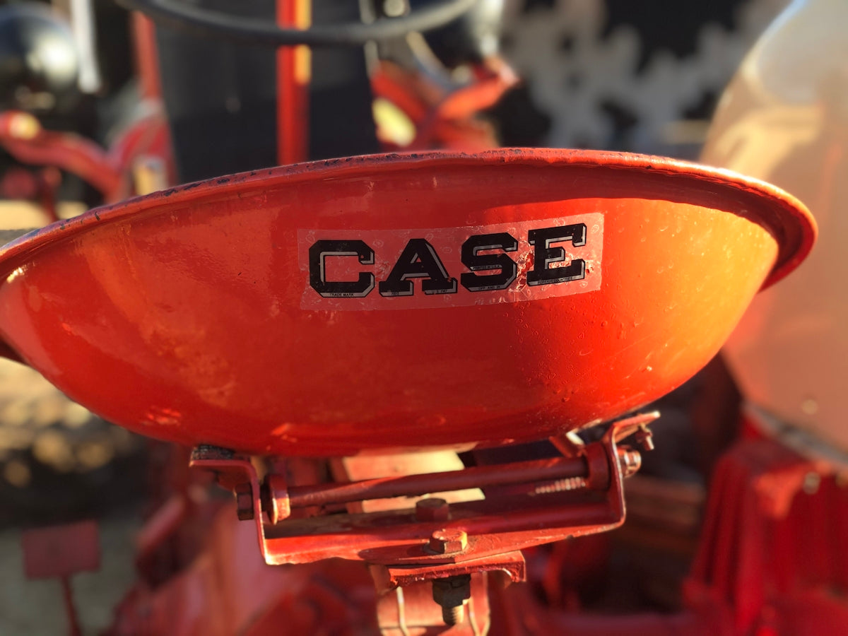 a close up of a case logo on a red fire hydrant