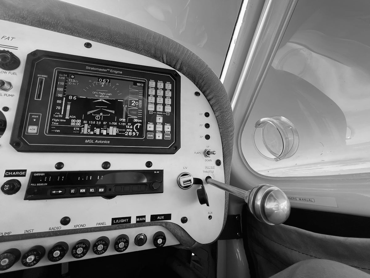 the dashboard of a small airplane with buttons and controls