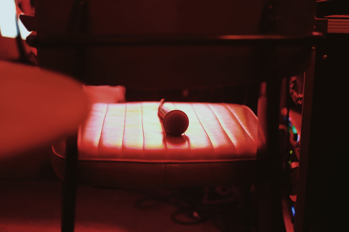 a chair with a cup on it in a room