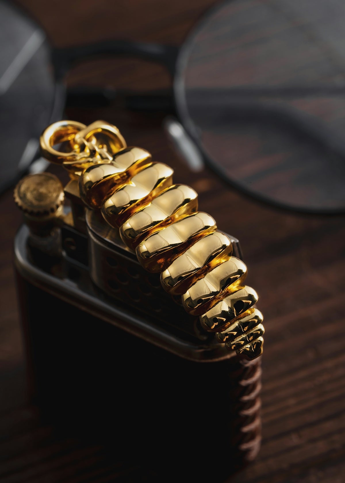 a pair of glasses sitting on top of a wooden table