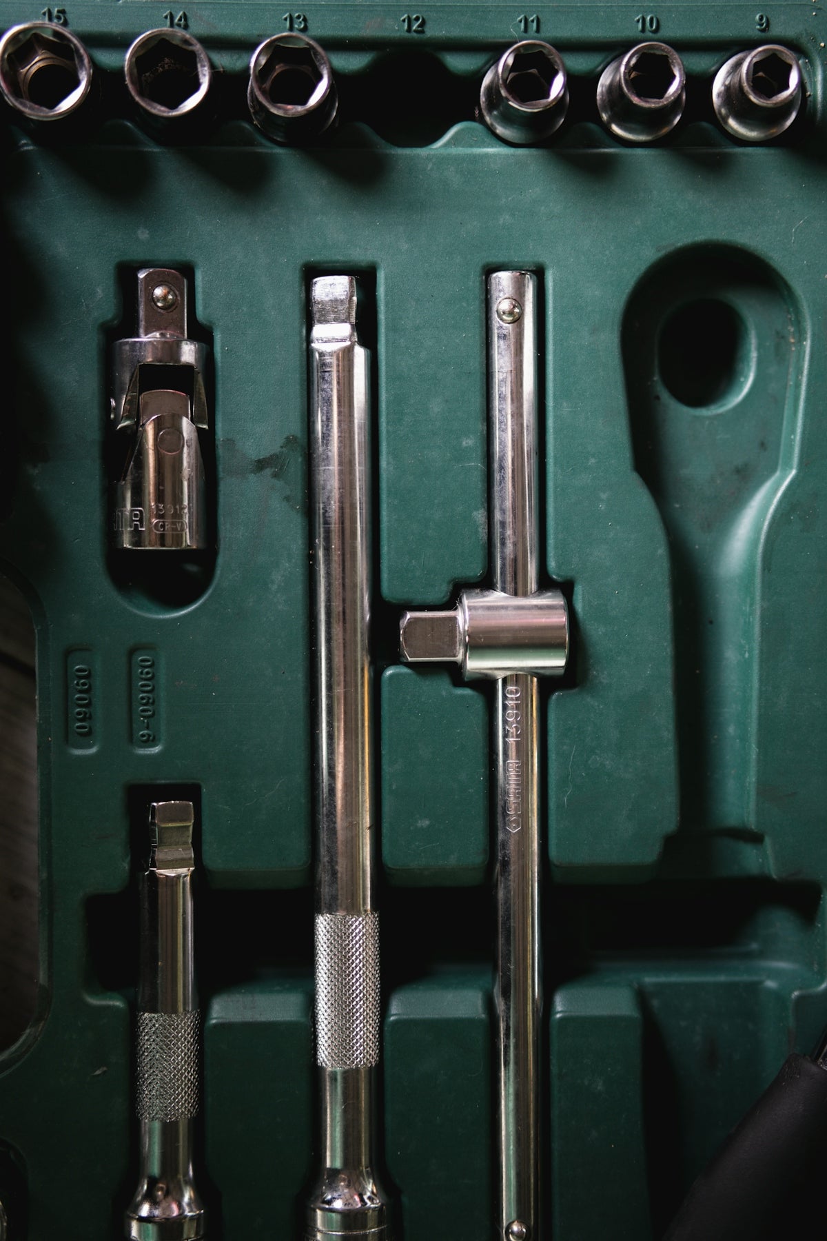 a green box with a bunch of tools inside of it