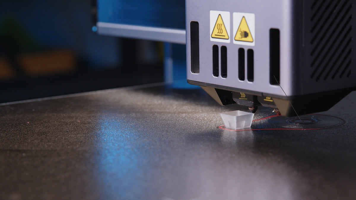 A close up of a machine that is cutting something